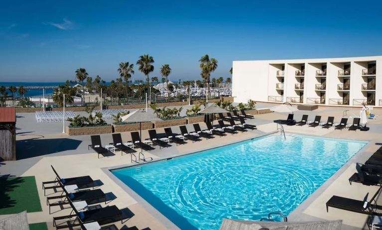 Lovely outdoor pool and pool chairs at Sonesta Redondo Beach & Marina.