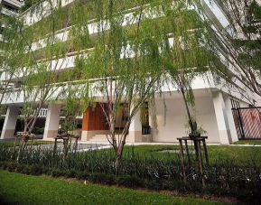 Hotel exterior with garden at Fraser Suites Sukhumvit, Bangkok.