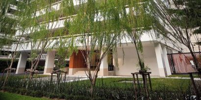 Hotel exterior with garden at Fraser Suites Sukhumvit, Bangkok.