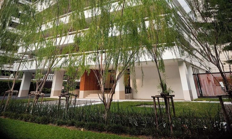 Hotel exterior with garden at Fraser Suites Sukhumvit, Bangkok.