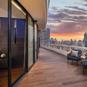 Outdoor terrace with seating area at Fraser Suites Sukhumvit, Bangkok.