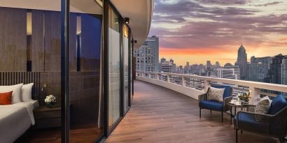 Outdoor terrace with seating area at Fraser Suites Sukhumvit, Bangkok.