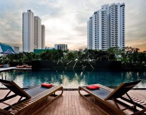 Ourdoor pool with pool loungers at Fraser Suites Sukhumvit, Bangkok.