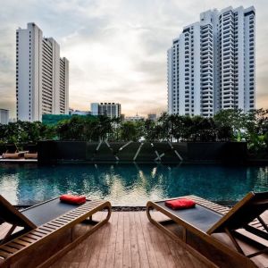 Ourdoor pool with pool loungers at Fraser Suites Sukhumvit, Bangkok.