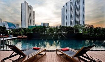 Ourdoor pool with pool loungers at Fraser Suites Sukhumvit, Bangkok.