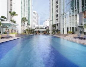 Luxurious outdoor pool at Fraser Residence Sudirman Jakarta.