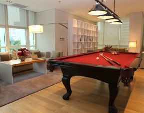 Pool table and game room at Fraser Residence Sudirman Jakarta.