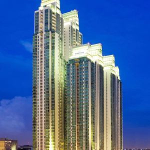 Hotel exterior at night at Fraser Residence Sudirman Jakarta.