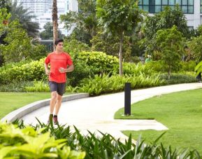 Running outdoors in the garden at Fraser Place Setiabudi Jakarta.