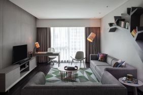 Spacious king room with lounge at Fraser Place Setiabudi Jakarta.