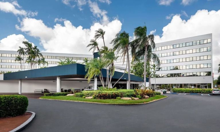 Parking and hotel exterior at Sonesta Miami Airport.