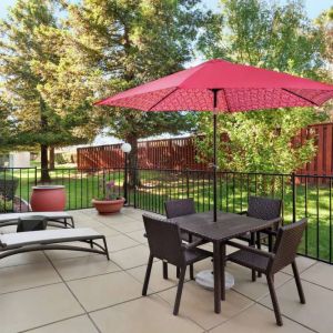 Outdoor garden and terrace at Hampton Inn Tracy.