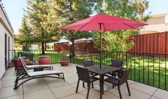 Outdoor garden and terrace at Hampton Inn Tracy.