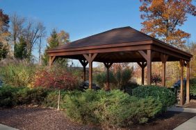 Outdoor terrace and garden at Sonesta Simply Suites Cleveland North Olmsted Airport.