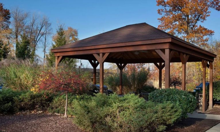 Outdoor terrace and garden at Sonesta Simply Suites Cleveland North Olmsted Airport.