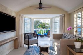 Spacious king room with TV and lounge at Royal Sonesta San Juan.