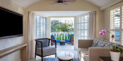 Spacious king room with TV and lounge at Royal Sonesta San Juan.