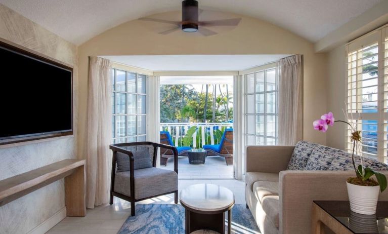 Spacious king room with TV and lounge at Royal Sonesta San Juan.