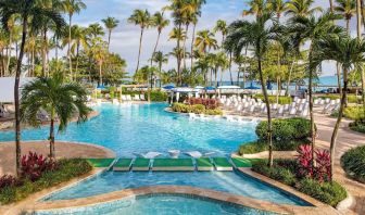 Outdoor pool with palm trees at Royal Sonesta San Juan.