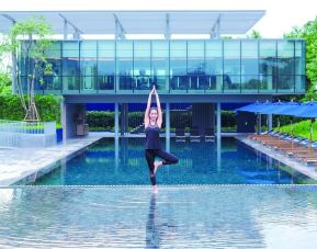 Outdoor pool and fitness space at Modena By Fraser Buriram.