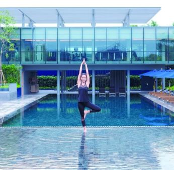 Outdoor pool and fitness space at Modena By Fraser Buriram.