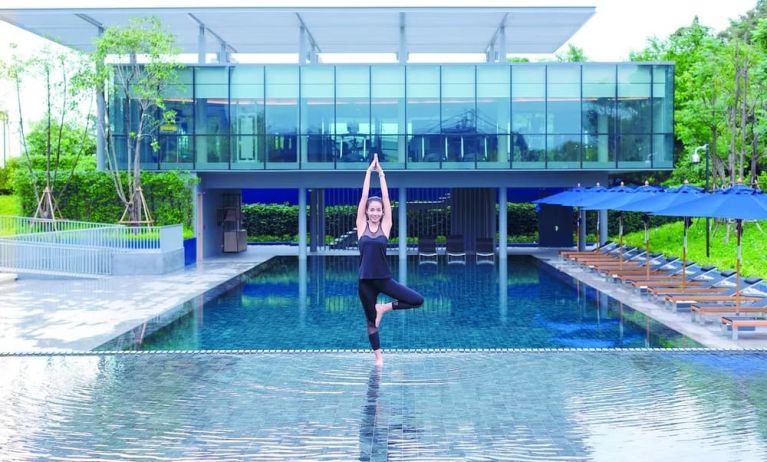 Outdoor pool and fitness space at Modena By Fraser Buriram.