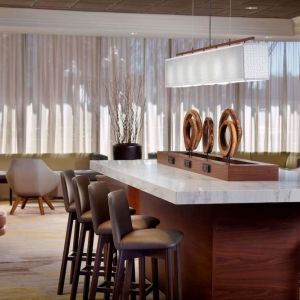 Coworking space and bar area at Sonesta Select Atlanta Cumberland Galleria.
