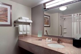 Guest bathroom with showre at Sonesta Select Atlanta Cumberland Galleria.