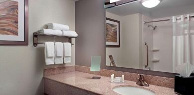 Guest bathroom with showre at Sonesta Select Atlanta Cumberland Galleria.