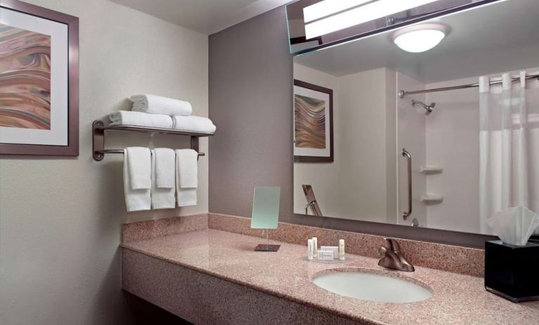 Guest bathroom with showre at Sonesta Select Atlanta Cumberland Galleria.