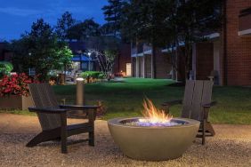 Outdoor seating and fire pit at Sonesta Select Boston Foxborough Mansfield.