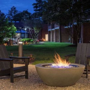 Outdoor seating and fire pit at Sonesta Select Boston Foxborough Mansfield.