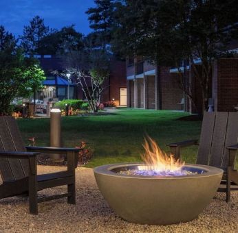 Outdoor seating and fire pit at Sonesta Select Boston Foxborough Mansfield.