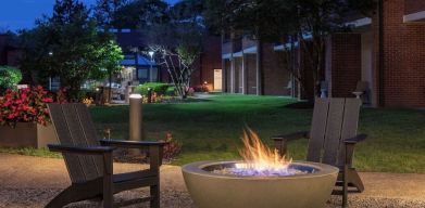 Outdoor seating and fire pit at Sonesta Select Boston Foxborough Mansfield.