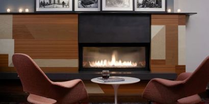 Cozy lounge with fire place at The Fifty Sonesta Select New York.