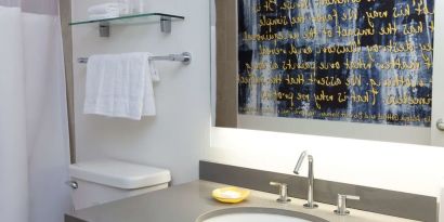 Guest bathroom with shower at The Fifty Sonesta Select New York.