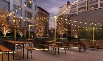 Outdoor lounge with night lights at The Tillary Hotel.