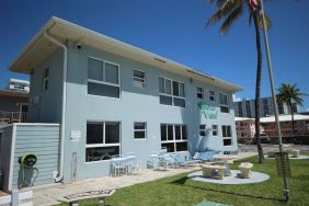 Hotel with lounge chairs at Shore View Hotel.