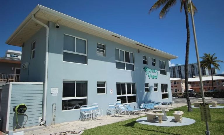 Hotel with lounge chairs at Shore View Hotel.