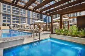 Three outdoor pools at Hilton Dubai Al Habtoor City.