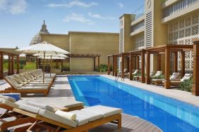 Pool lounge chairs at Hilton Dubai Al Habtoor City.