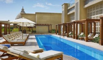 Pool lounge chairs at Hilton Dubai Al Habtoor City.