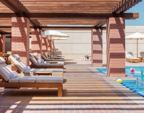 Outdoor lounge chairs at Hilton Dubai Al Habtoor City.