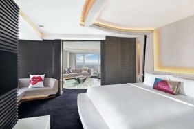 Romantic king room with natural light at V Hotel Dubai.