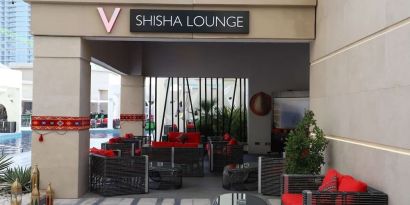 Street-side hotel lounge and restaurant at V Hotel Dubai.