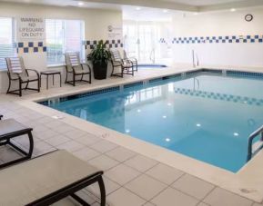 Indoor pool with lounge chairs at Hilton Garden Inn Kennett Square.