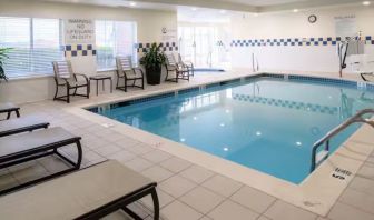 Indoor pool with lounge chairs at Hilton Garden Inn Kennett Square.