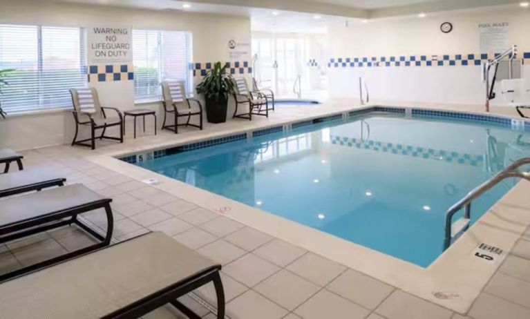 Indoor pool with lounge chairs at Hilton Garden Inn Kennett Square.