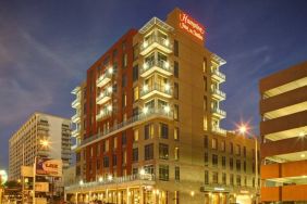 Hotel exterior at night at Hampton Inn & Suites Austin @ The UniversityCapitol.