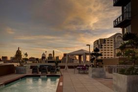 Outdoor pool at sunset at Hampton Inn & Suites Austin @ The UniversityCapitol.